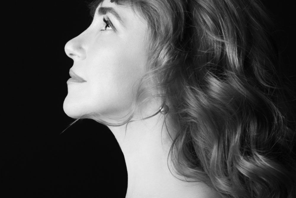 Happy woman after Midline Neck Lift treatment at L&P Aesthetics